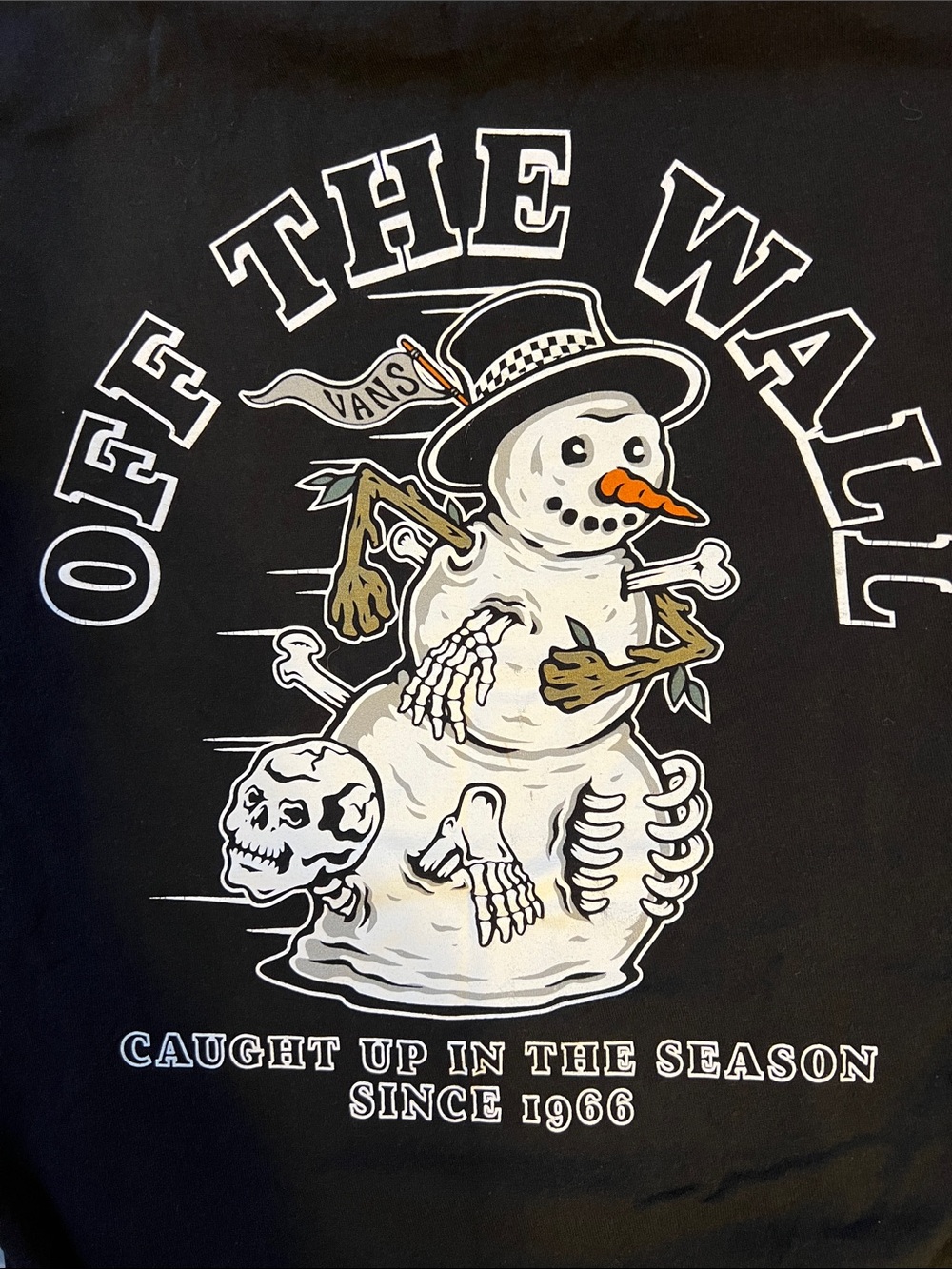 Vans Black Tee with Small White Logo and Character Caught Up in the Season 1966